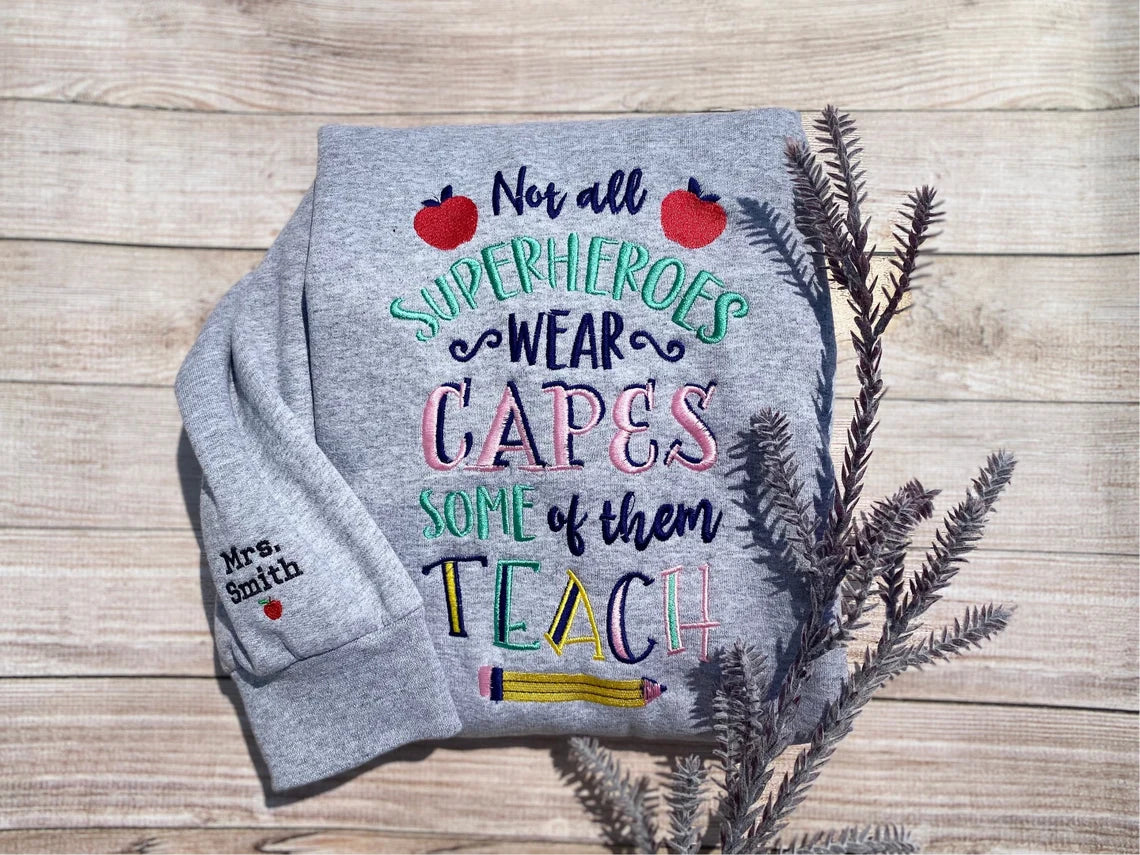 Not All Superheroes Wear Capes, Some Of Them Teach Embroidered Sweatshirt
